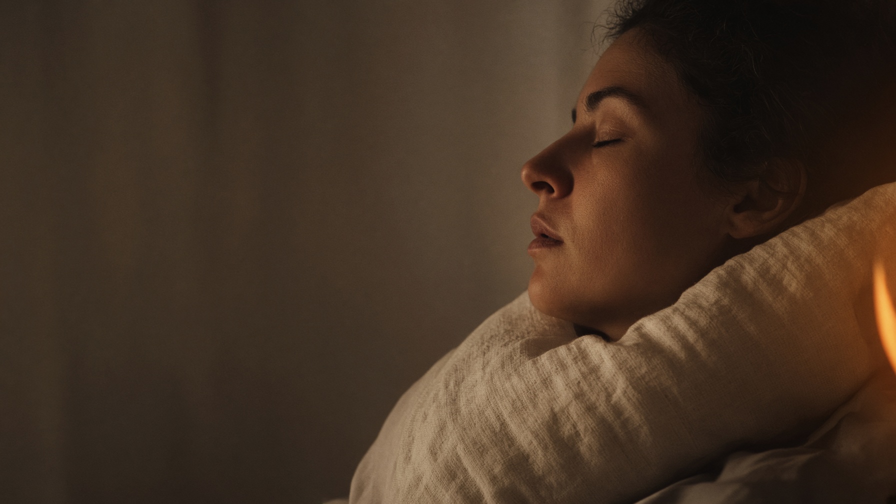 Side profile of a sleeping adult, showing the jaw and throat.